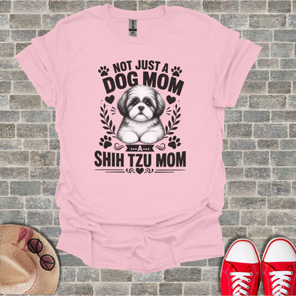 Pink t-shirt with black text and Shih Tzu graphic: "Not just a dog mom, a Shih Tzu mom."