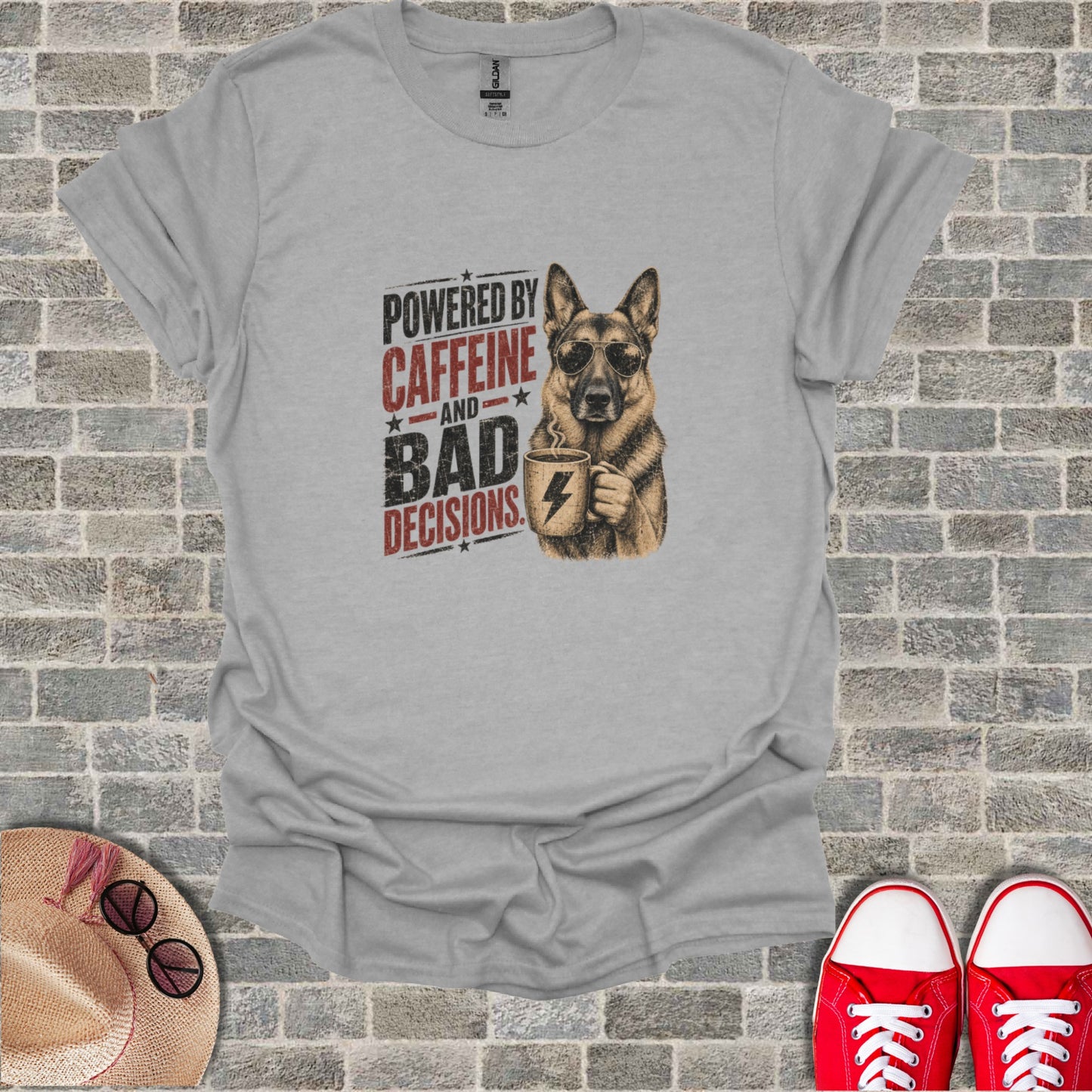 T-shirt with distressed graphic of a German Shepherd holding coffee, text reads "Powered by Caffeine and Bad Decisions".