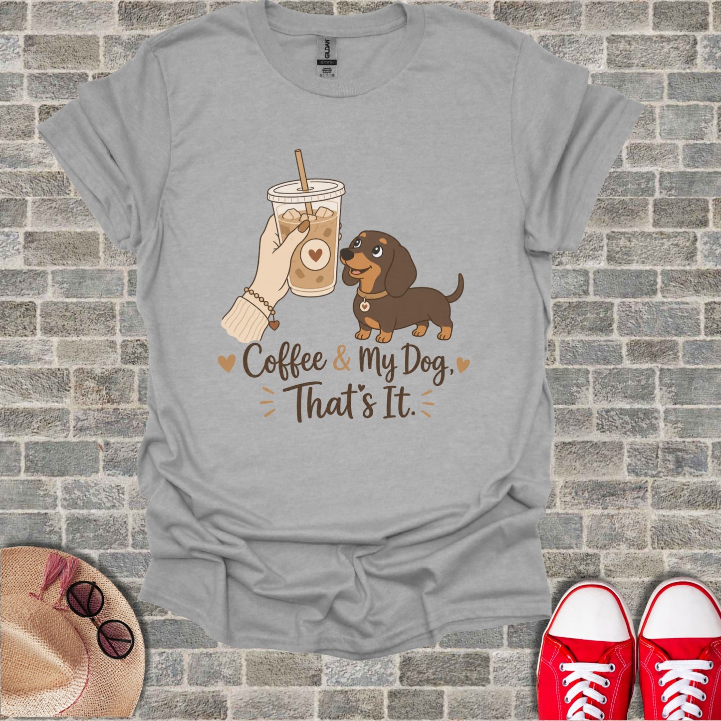 Grey t-shirt with graphic of a dachshund, iced coffee, and text "Coffee & My Dog, That's It".