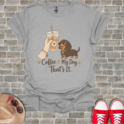 Grey t-shirt with graphic of a dachshund, iced coffee, and text "Coffee & My Dog, That's It".