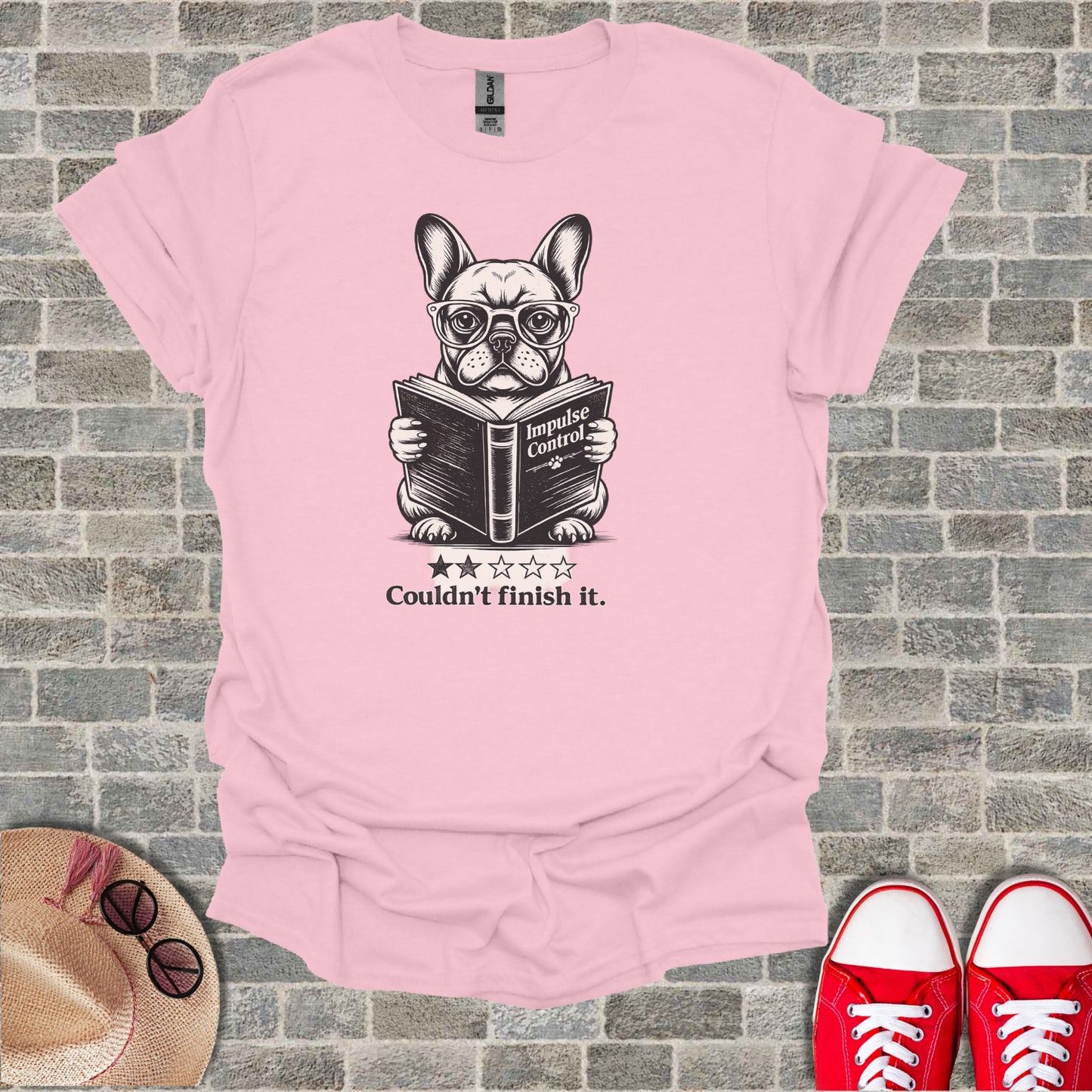 French bulldog wearing glasses reads a book titled "Impulse Control".