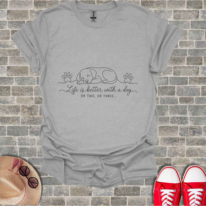 Gray t-shirt with sleeping dog and paw print graphic and text.