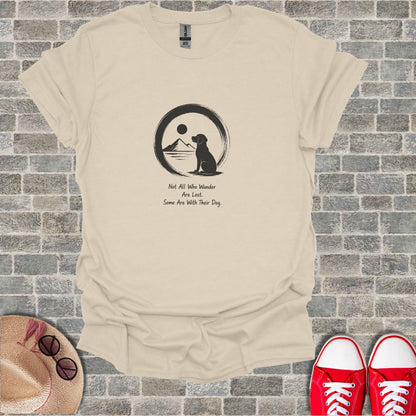 Cream t-shirt with black dog silhouette, mountains, sun, and text about dogs.