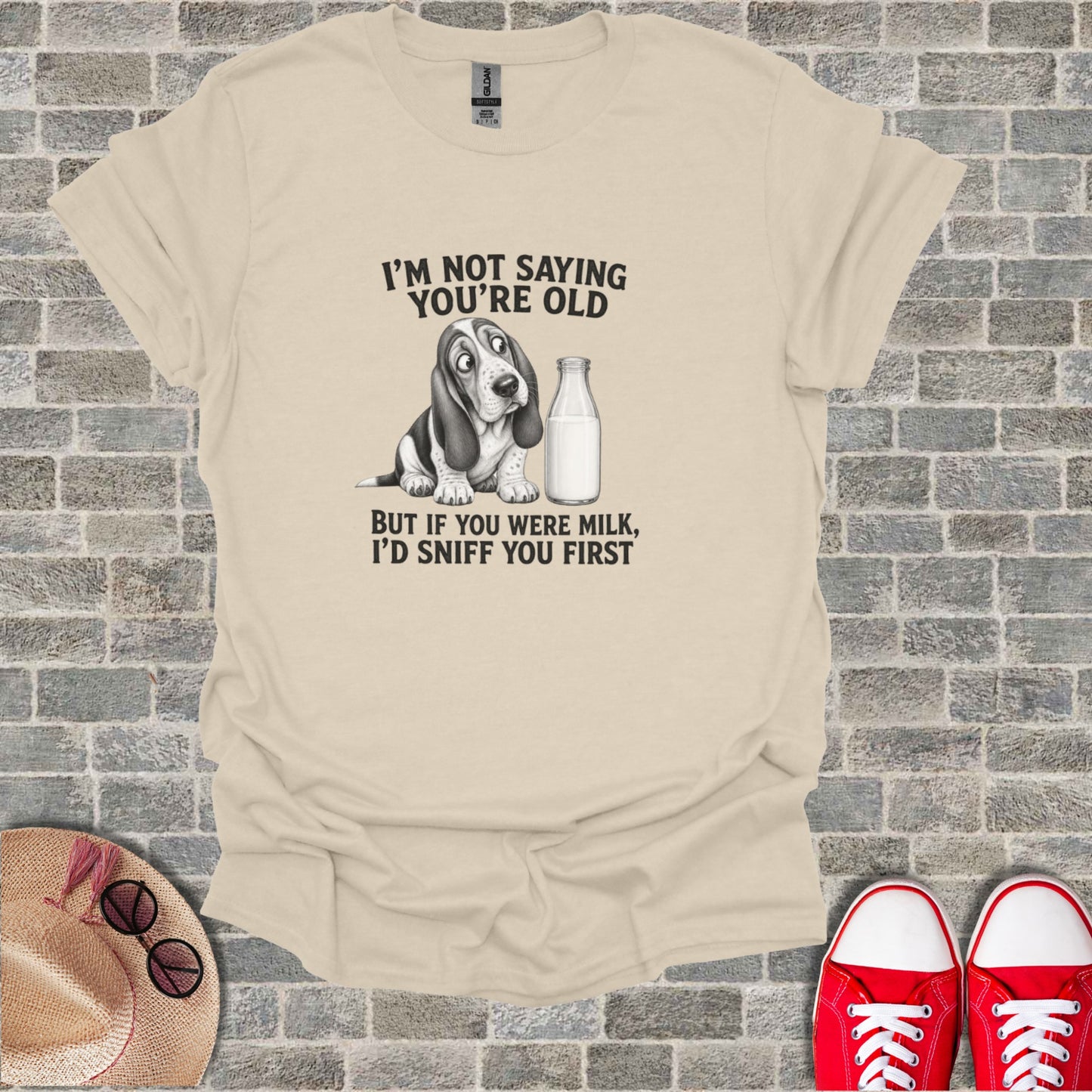 T-shirt with a cartoon Basset Hound and text about milk.