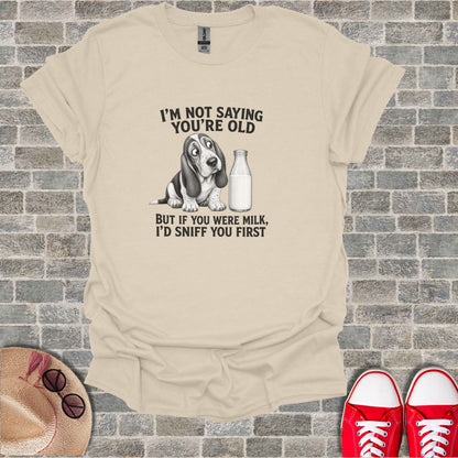 T-shirt with a cartoon Basset Hound and text about milk.