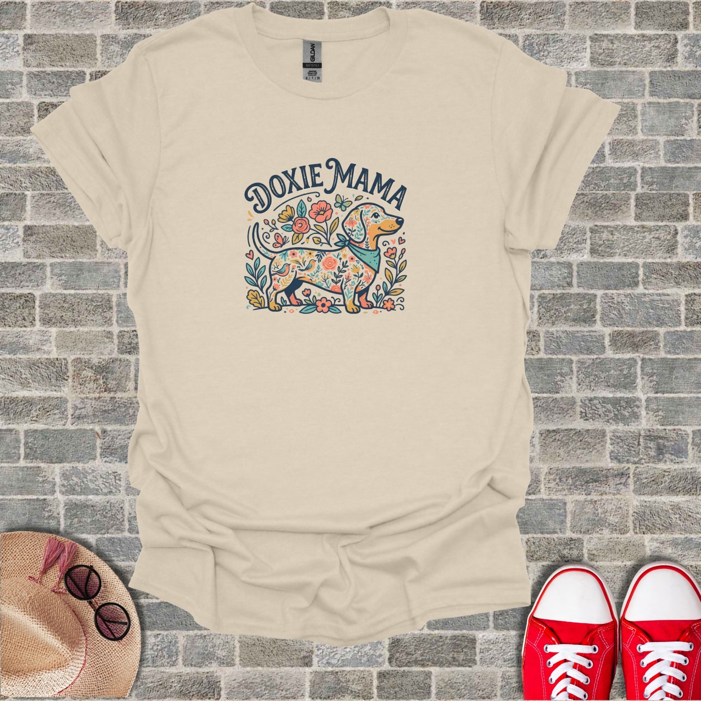 Dachshund with flowers and bandana, text "Doxie Mama".
