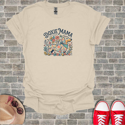 Dachshund with flowers and bandana, text "Doxie Mama".