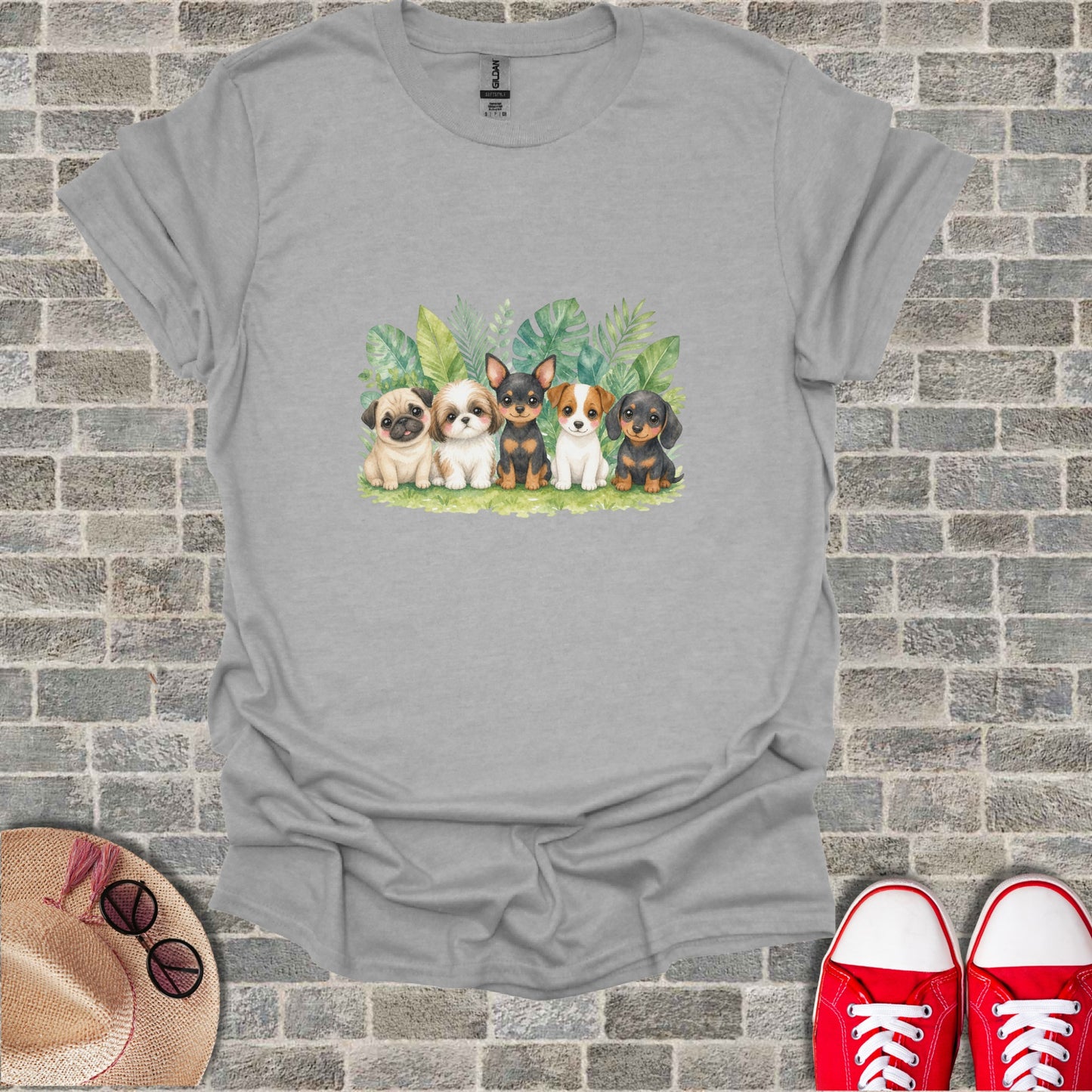 Watercolor painting of five puppies sitting in a row with plants behind them.