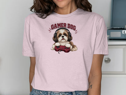 Shih Tzu dog wearing headphones and holding a video game controller.