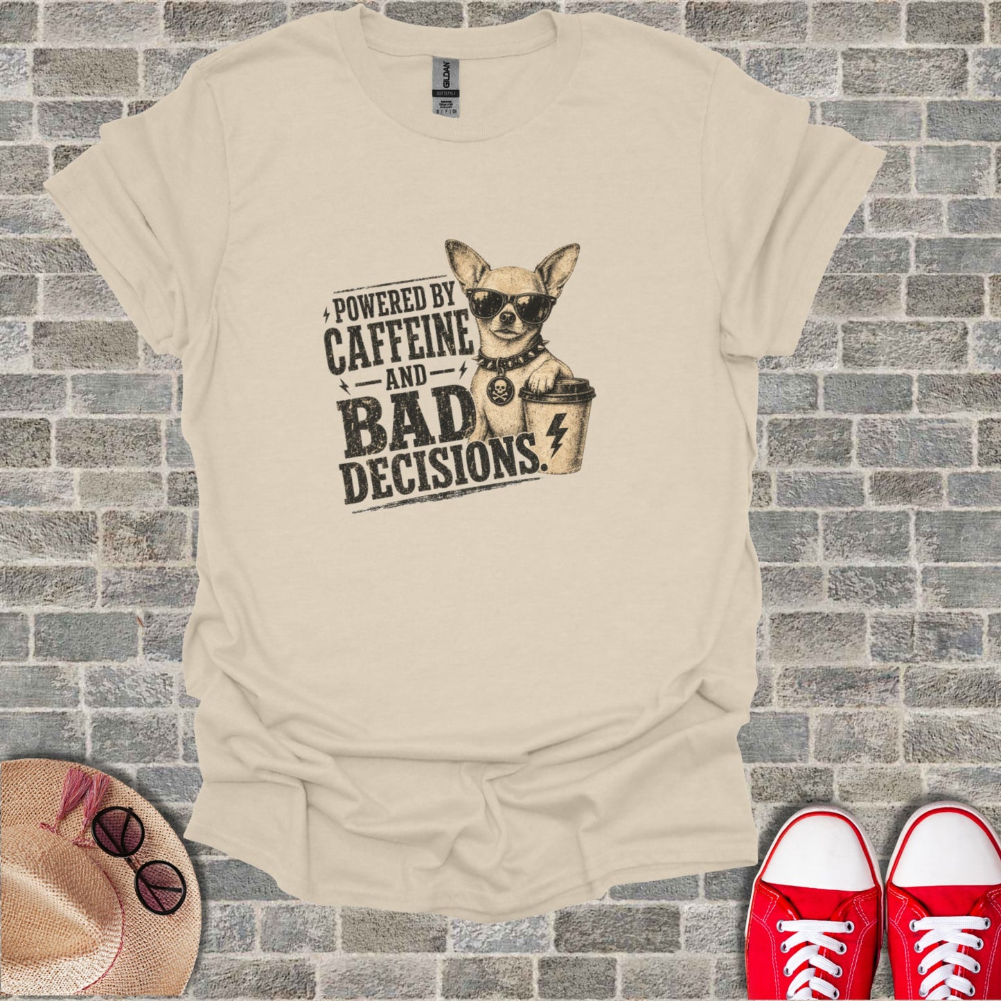 T-shirt with graphic of chihuahua wearing sunglasses and holding coffee cup, text "Powered by Caffeine and Bad Decisions".