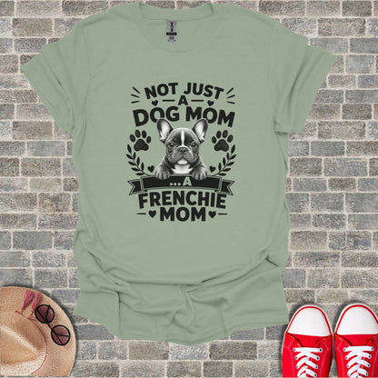 French bulldog graphic on a light green t-shirt reads "Not Just a Dog Mom... A Frenchie Mom".