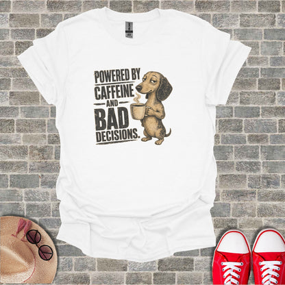 White t-shirt with dachshund holding coffee and text "Powered by Caffeine and Bad Decisions."