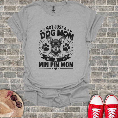 Grey t-shirt with the text "NOT JUST A DOG MOM A MIN PIN MOM".