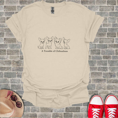 Cream t-shirt with line drawing of four chihuahuas and text "A Tremble of Chihuahuas".