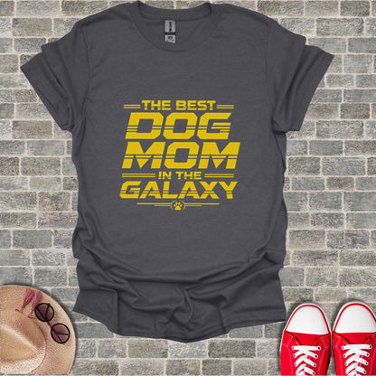Dark gray t-shirt with yellow text "THE BEST DOG MOM IN THE GALAXY"
