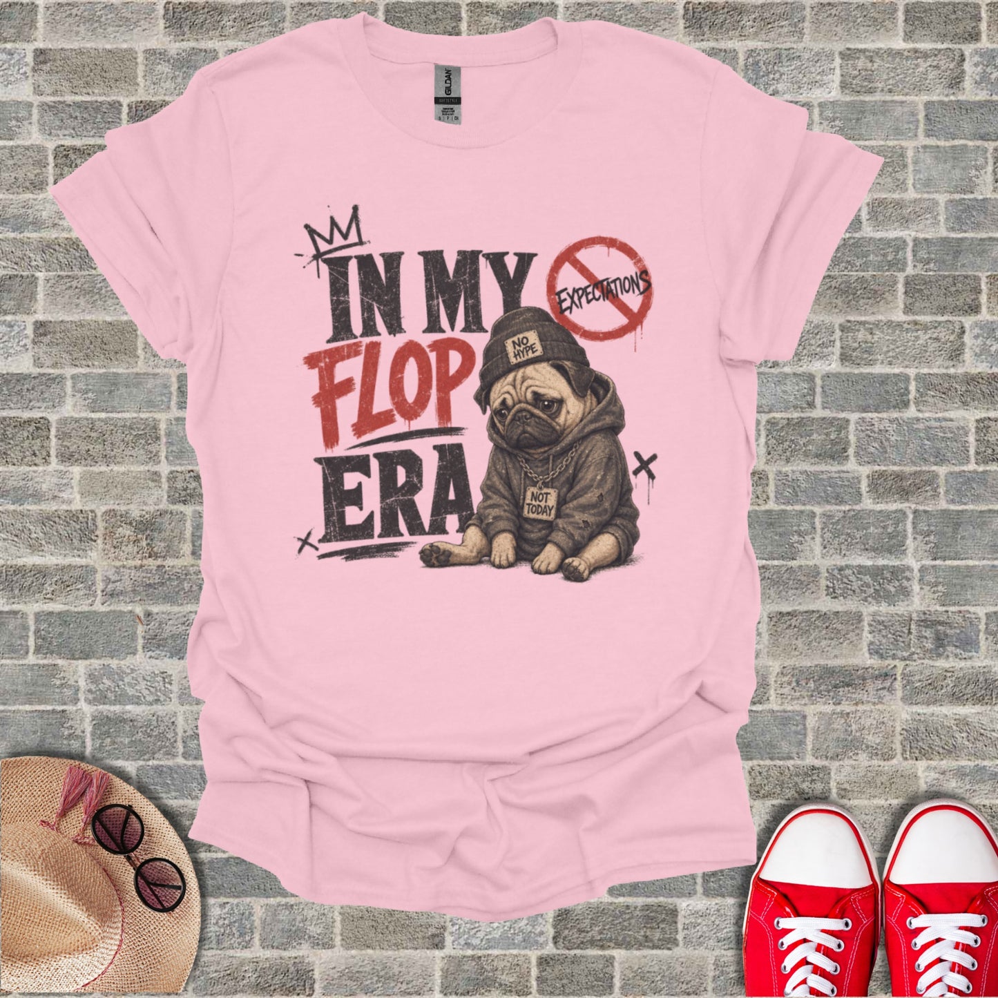 Pink t-shirt with a pug wearing a hoodie and the text "In My Flop Era."