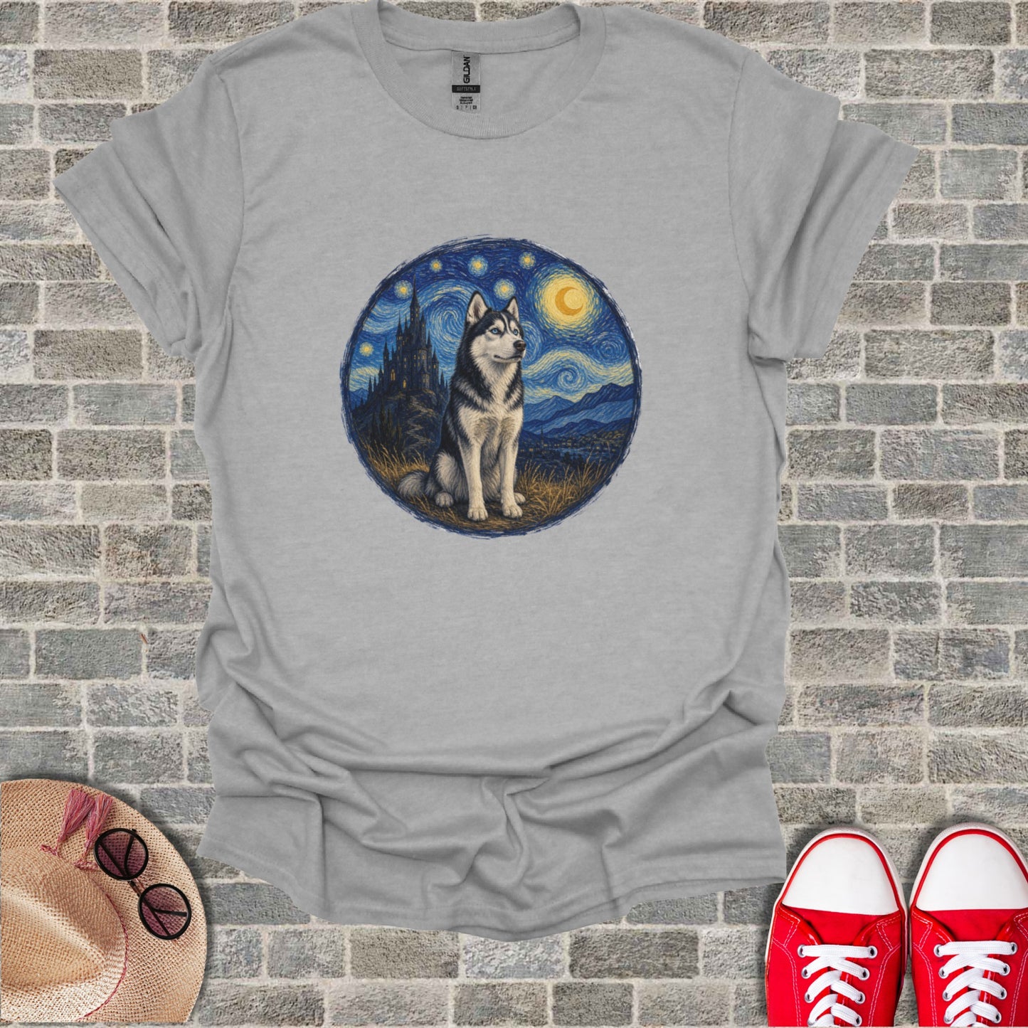 Husky dog in a starry night landscape, superimposed on a gray t-shirt.