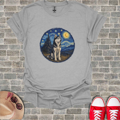 Husky dog in a starry night landscape, superimposed on a gray t-shirt.