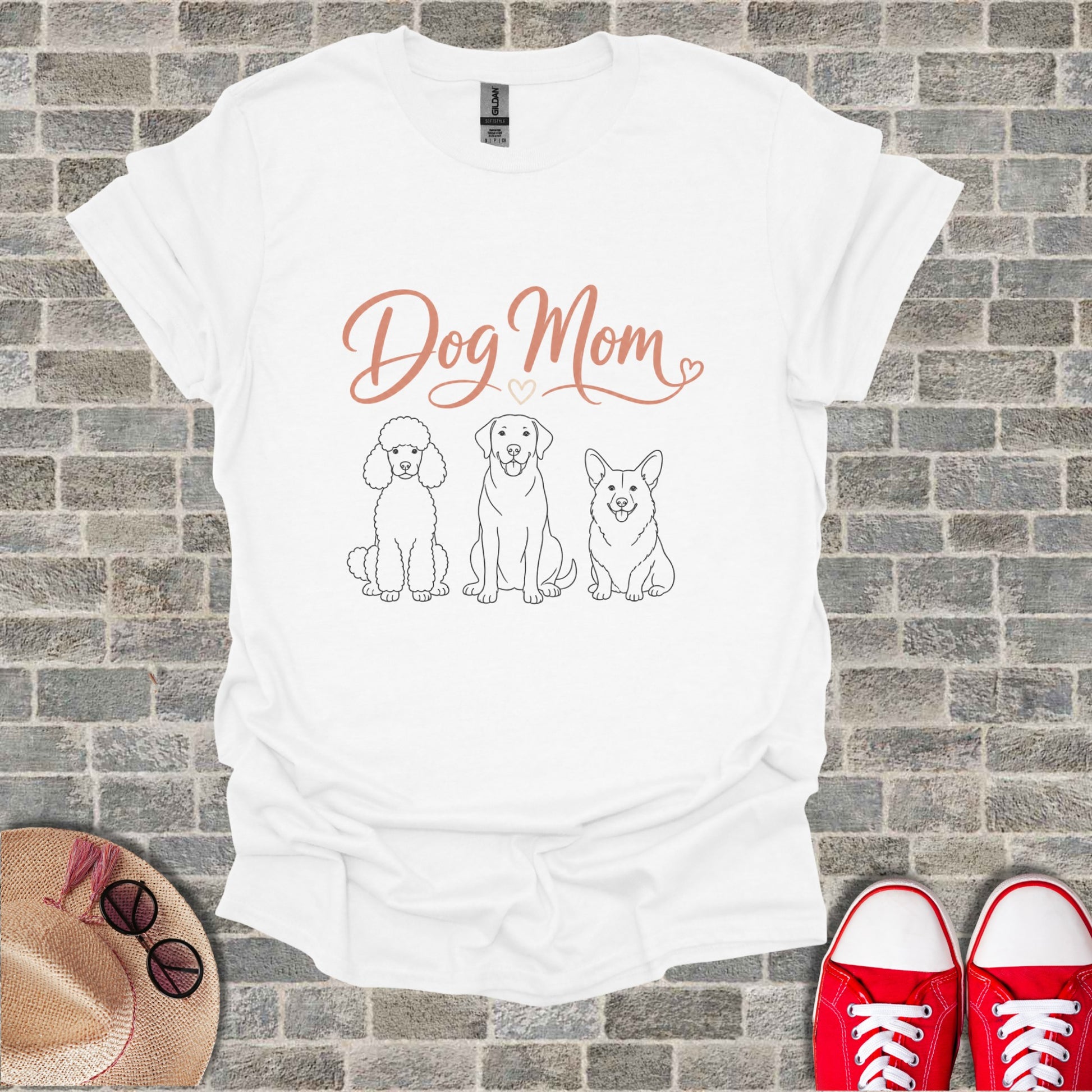 White t-shirt with "Dog Mom" text and line drawings of three dogs.