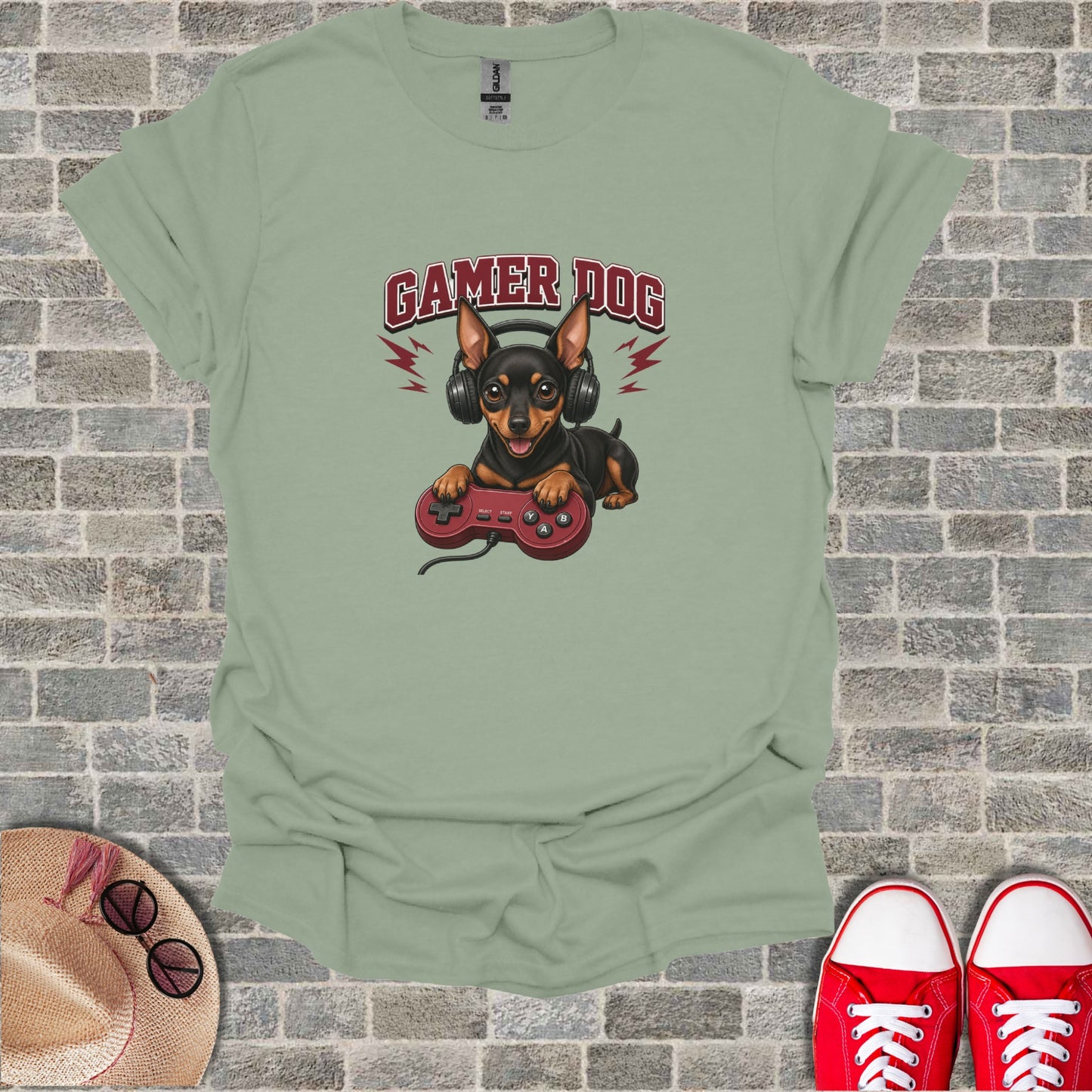 Dog wearing headphones holding video game controller, text "GAMER DOG".