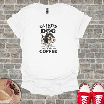 White t-shirt with text "All I Need is my Dog and a Little Bit of Coffee" and a graphic.
