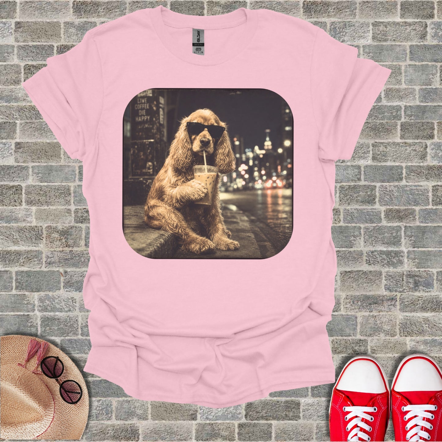 Cocker spaniel with sunglasses drinks coffee on city street at night