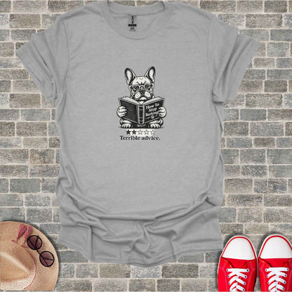 French bulldog wearing glasses reads a book titled "How to Stop Barking."