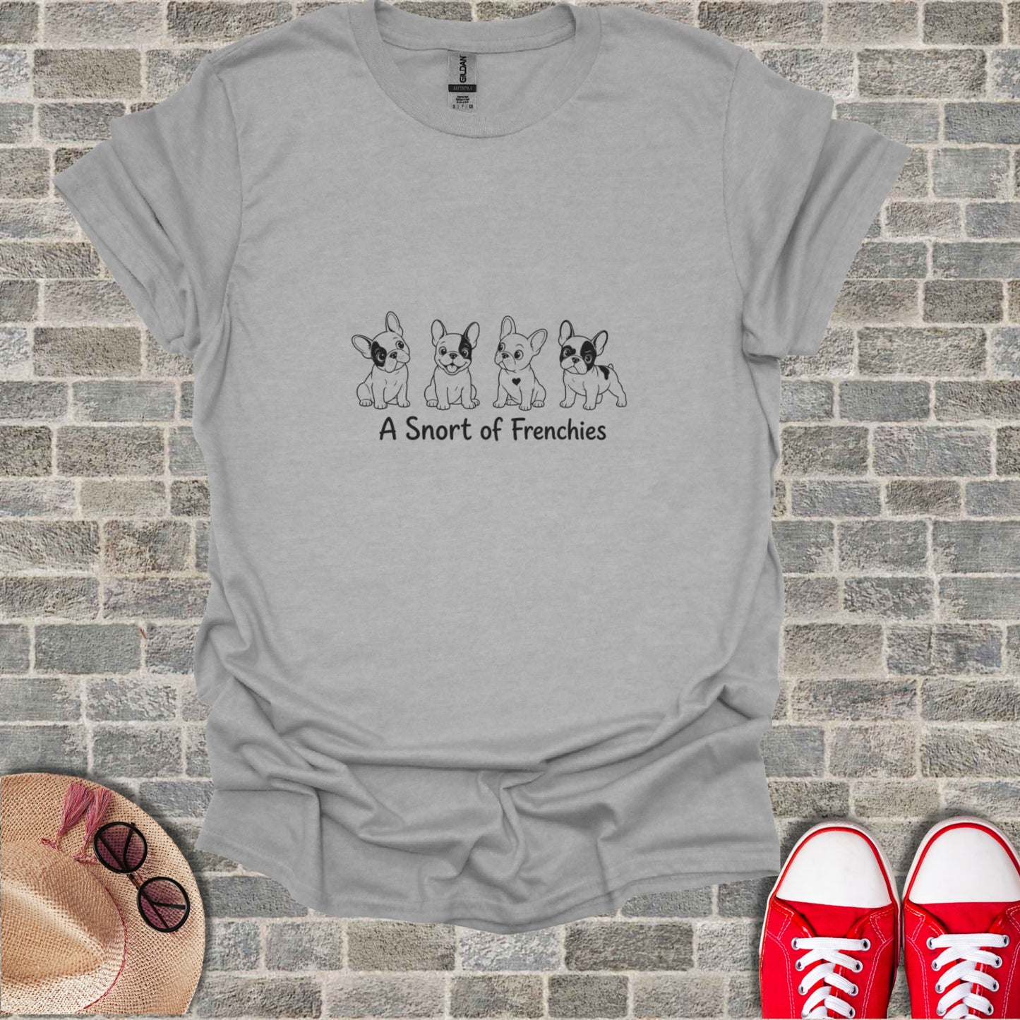 Gray t-shirt with four cartoon French Bulldogs and text "A Snort of Frenchies".