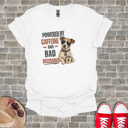 White t-shirt with cartoon dog wearing sunglasses holding coffee cup, text "POWERED BY CAFFEINE AND BAD DECISIONS."
