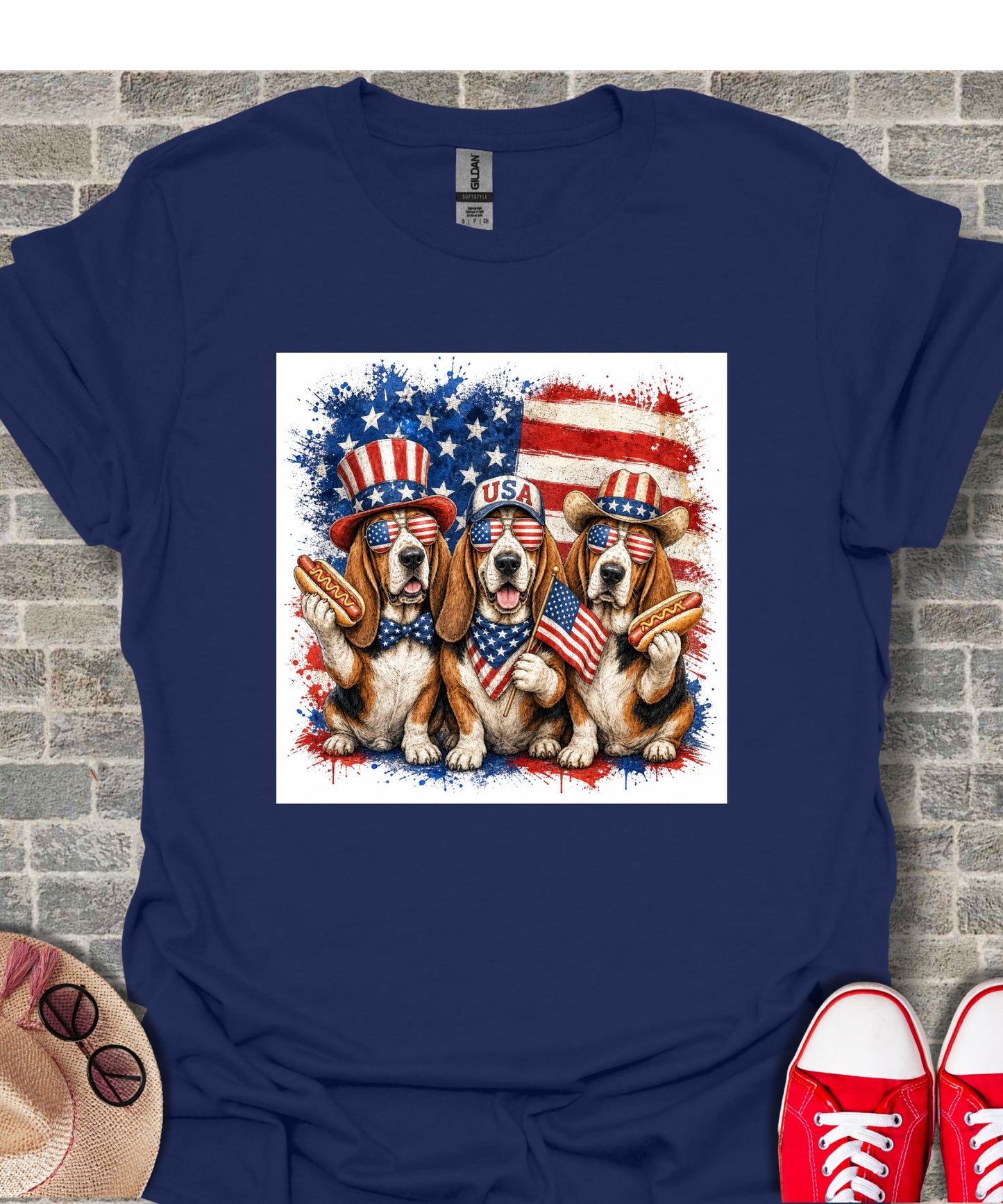 Three dogs in patriotic hats and sunglasses holding hot dogs and an American flag.