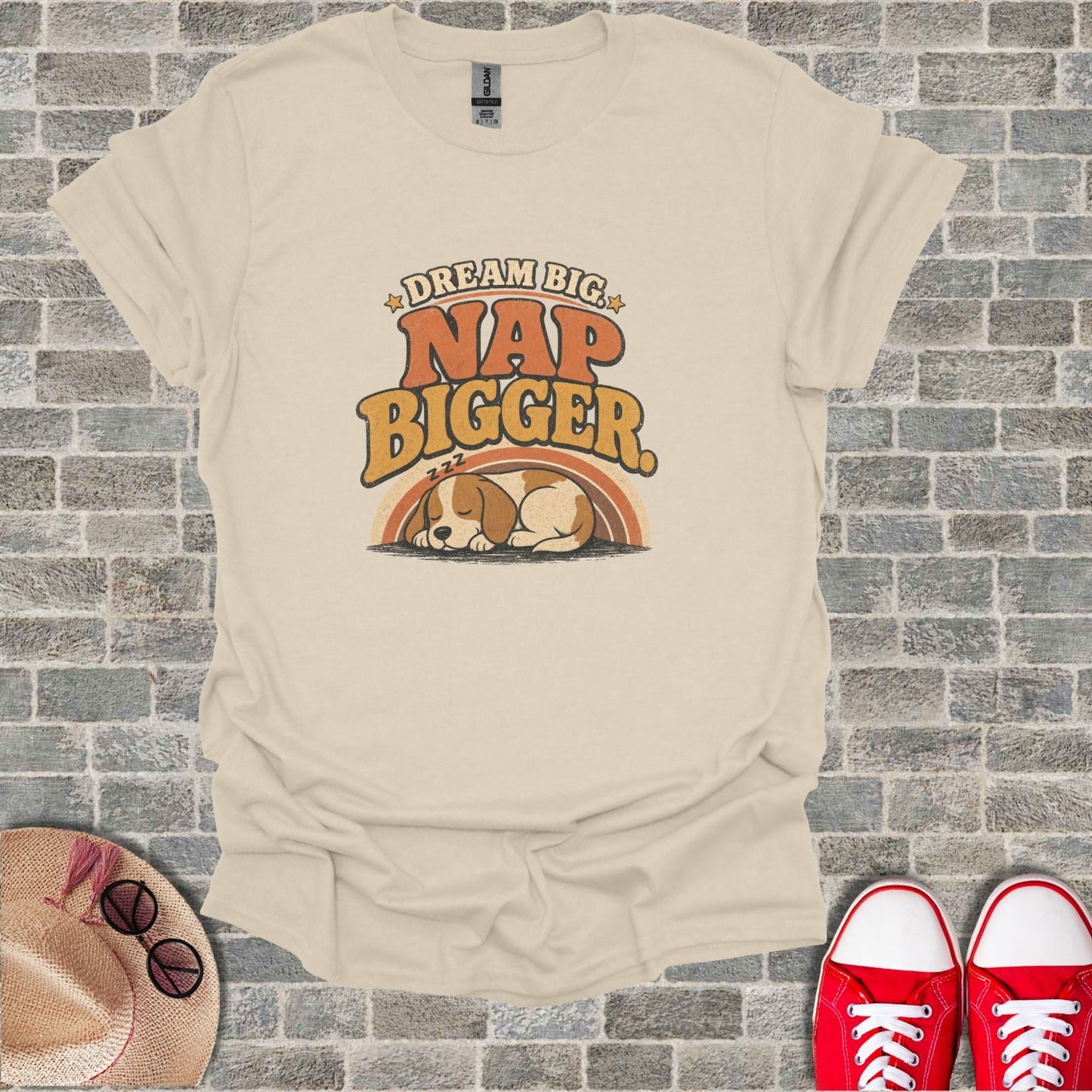 T-shirt with "DREAM BIG NAP BIGGER" text and sleeping puppy graphic.