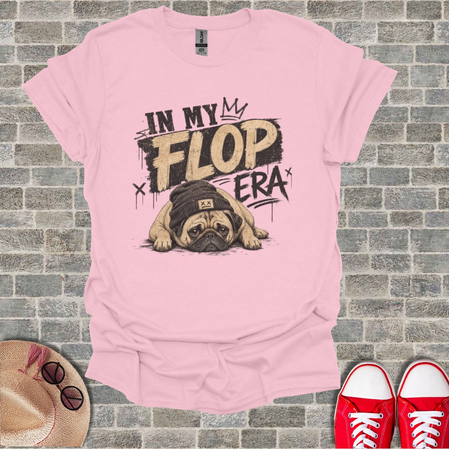 Pink t-shirt with a pug wearing a beanie and the text "In My Flop Era".