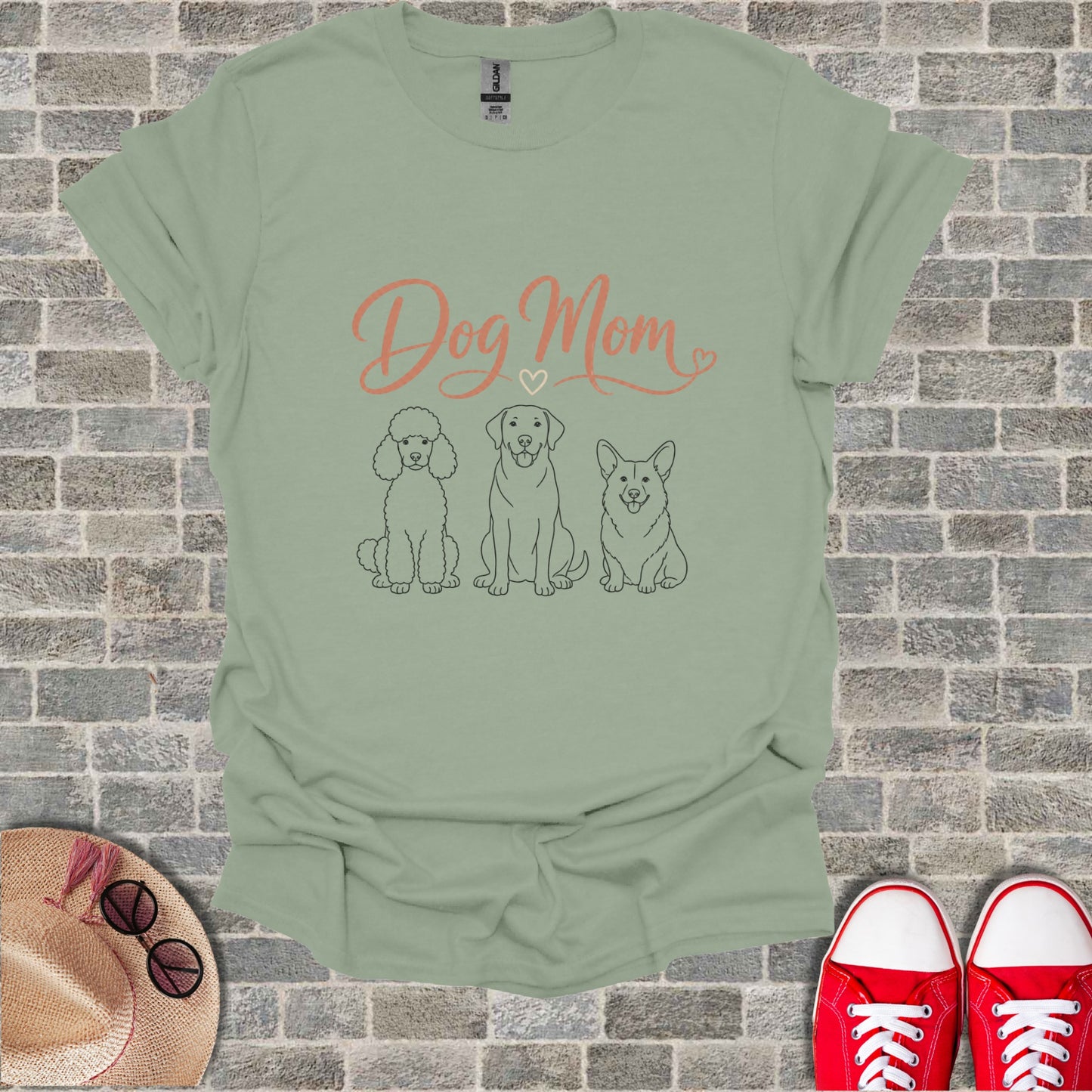 Light green t-shirt with "Dog Mom" text and three dog line drawings.