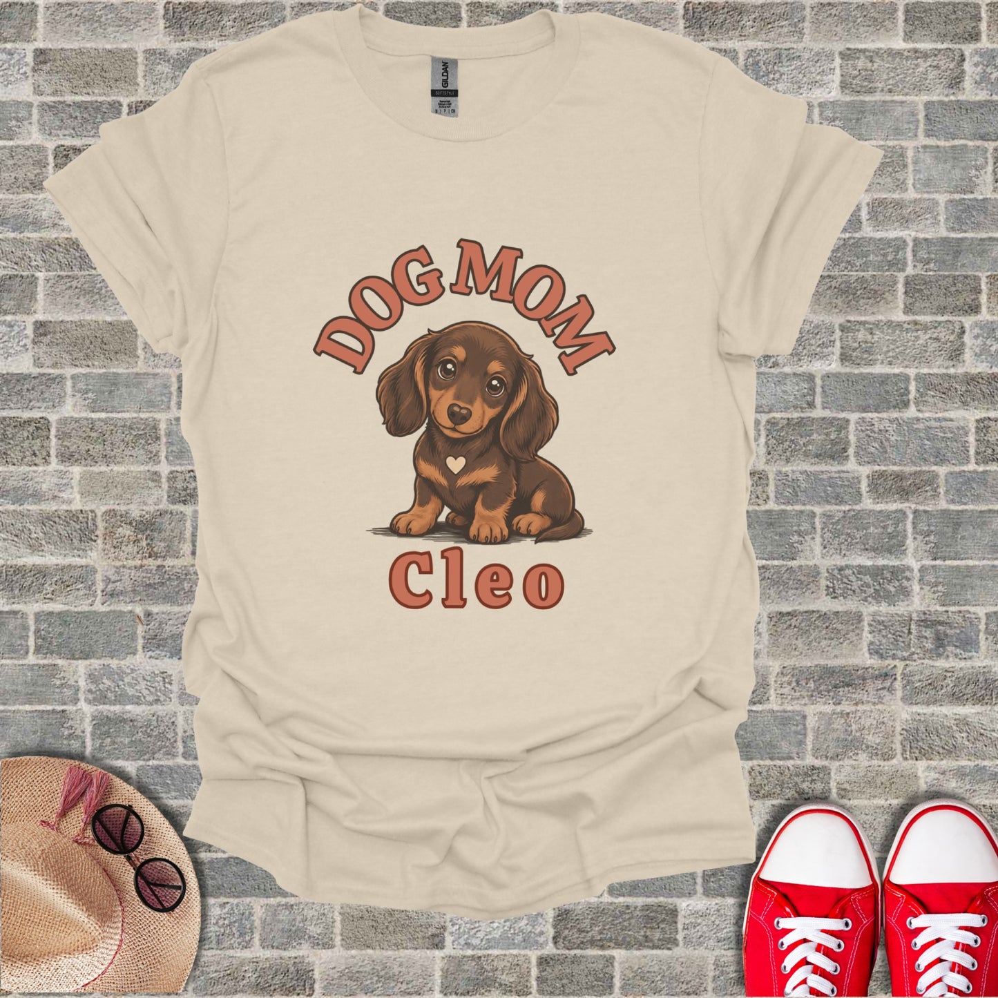 Tan t-shirt with a dachshund graphic and the text "DOG MOM Cleo".