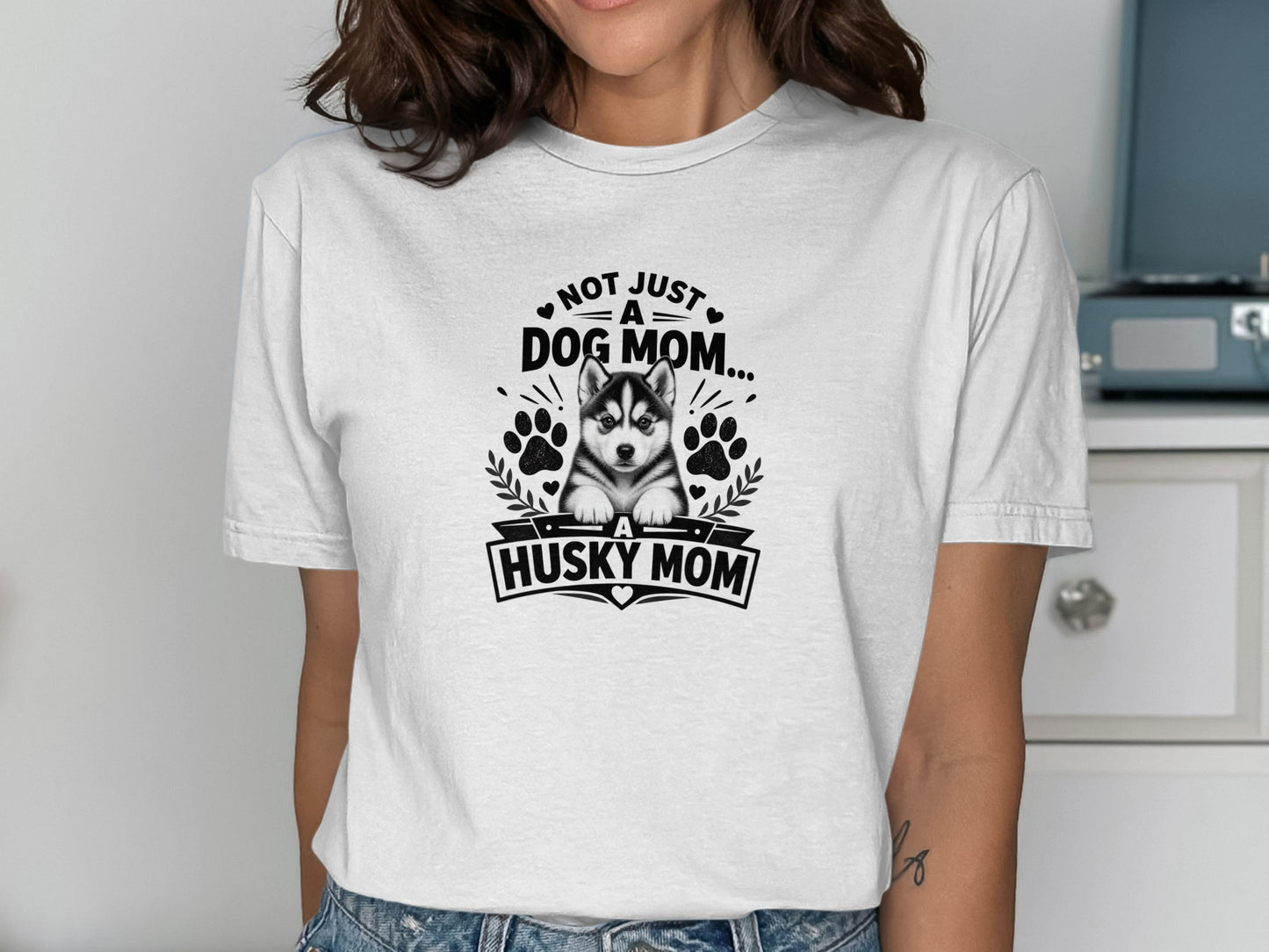 White t-shirt with husky puppy graphic and text "Not Just A Dog Mom... A Husky Mom".