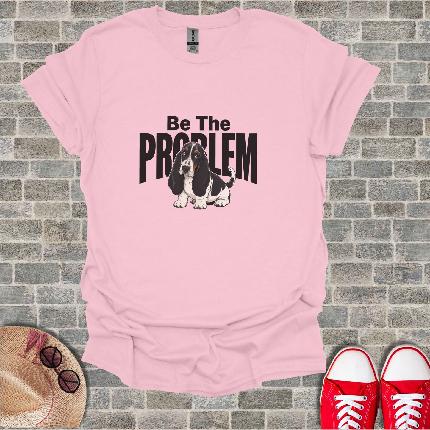 Pink t-shirt with "Be The Problem" text and a basset hound.
