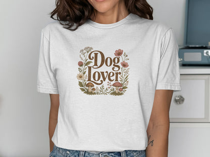 T-shirt with "Dog Lover" text surrounded by floral and mushroom illustrations.