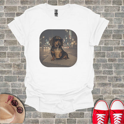 White t-shirt with a graphic of a dachshund wearing sunglasses sipping a drink.