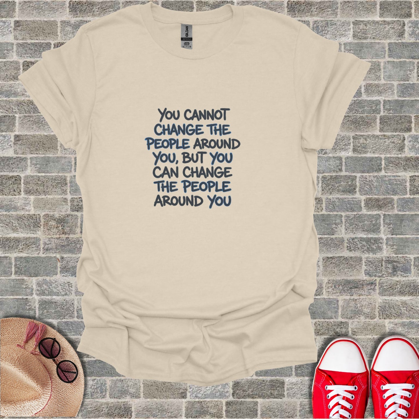 Cream t-shirt with "You cannot change the people around you, but you can change the people around you" in blue text.