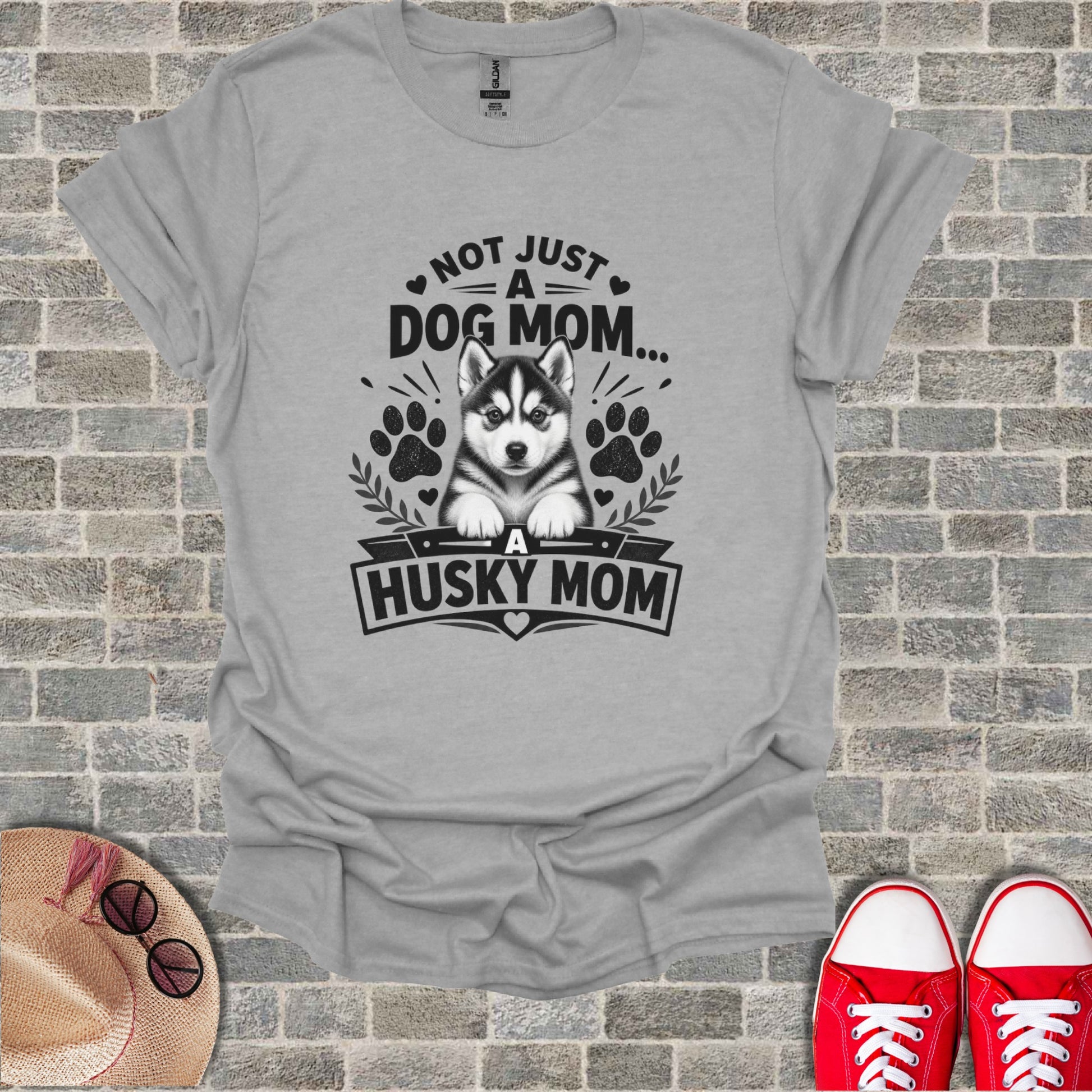 Grey t-shirt with black text and husky graphic. "Not Just A Dog Mom... A Husky Mom".