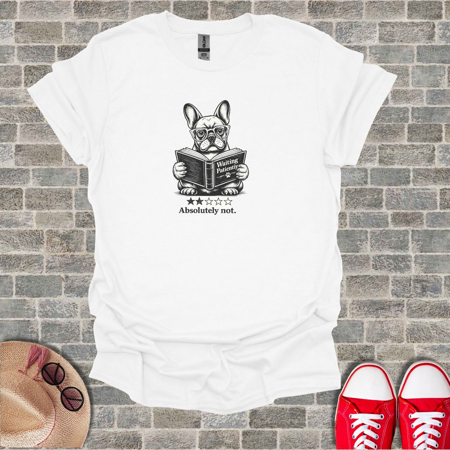 French bulldog wearing glasses reads book on white t-shirt, "Absolutely not."