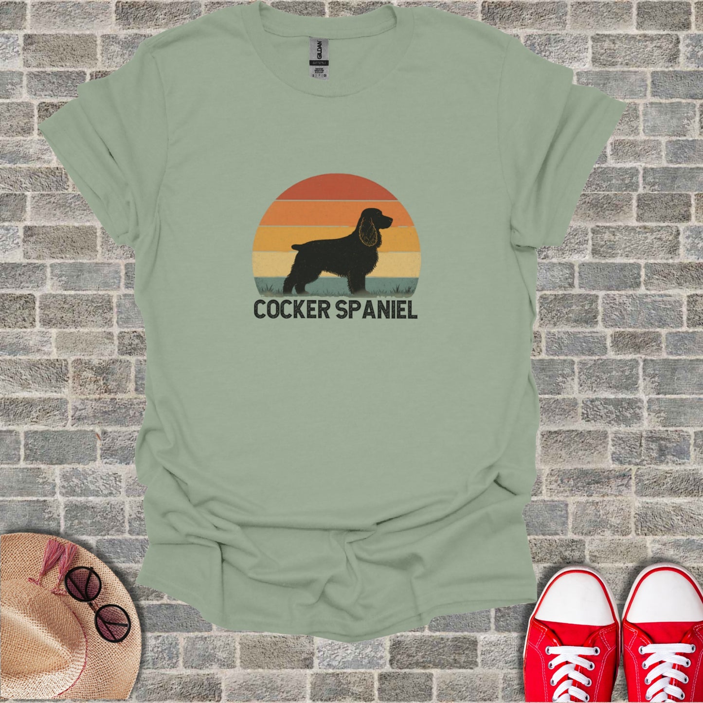 Green t-shirt with a retro Cocker Spaniel sunset graphic and text.