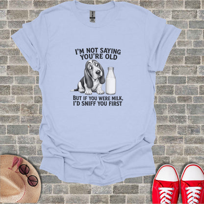 T-shirt with dog and milk graphic and humorous text.