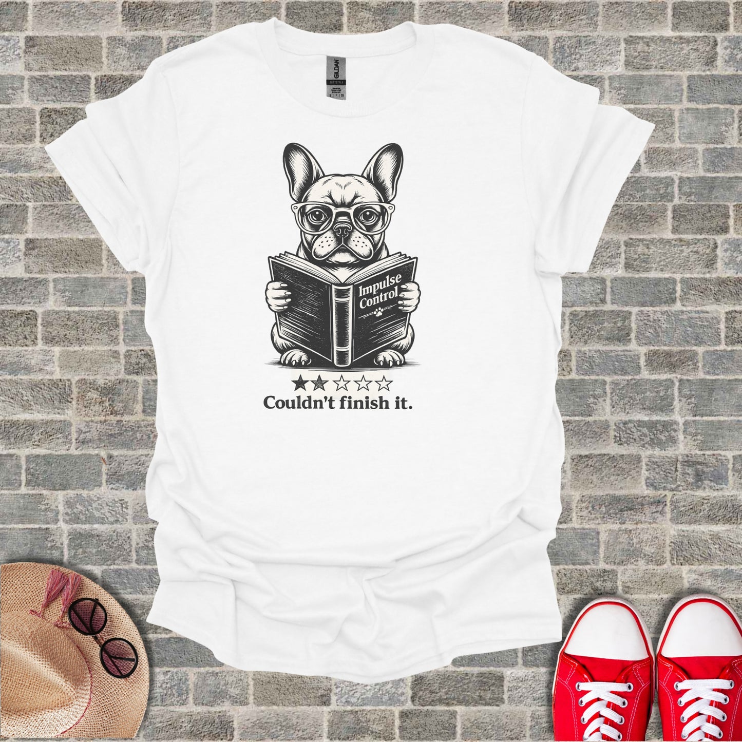 French bulldog wearing glasses reading a book titled "Impulse Control".