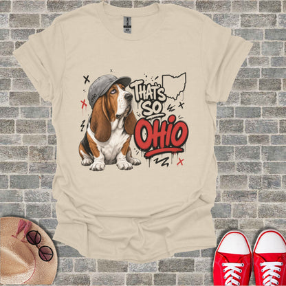 Basset hound wearing a cap with "That's So Ohio" text and outline of Ohio.