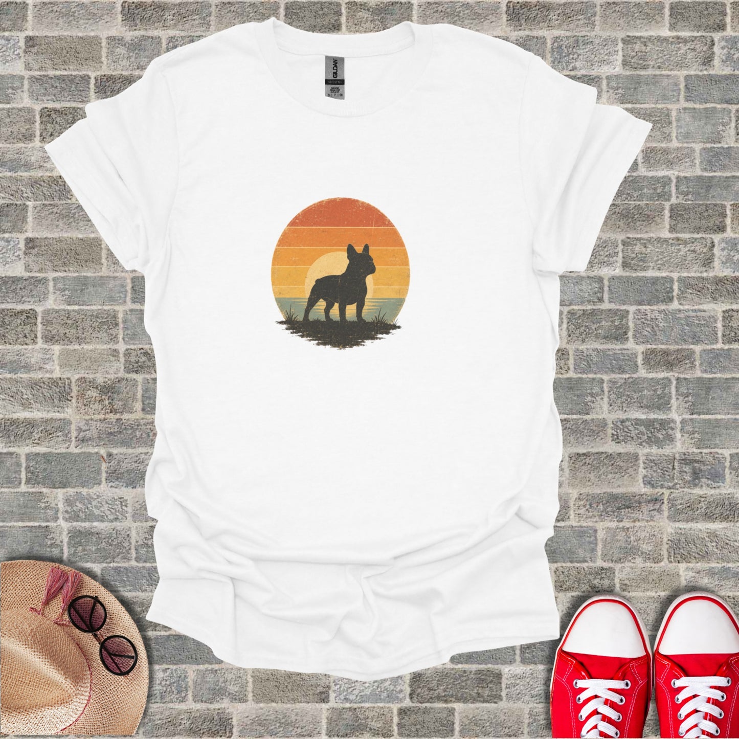White t-shirt with black French bulldog silhouette against a sunset graphic.