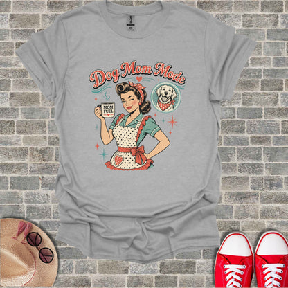 Retro style graphic on a grey t-shirt with text "Dog Mom Mode" and coffee cup.