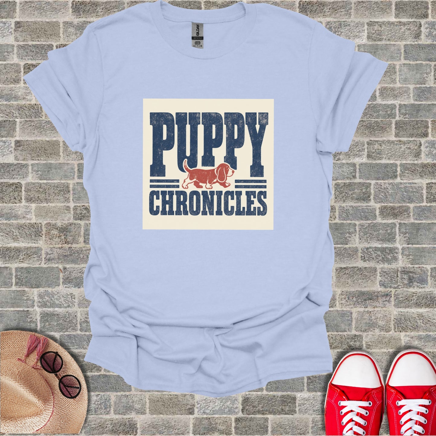 Light blue t-shirt with "PUPPY CHRONICLES" text and a dog illustration.