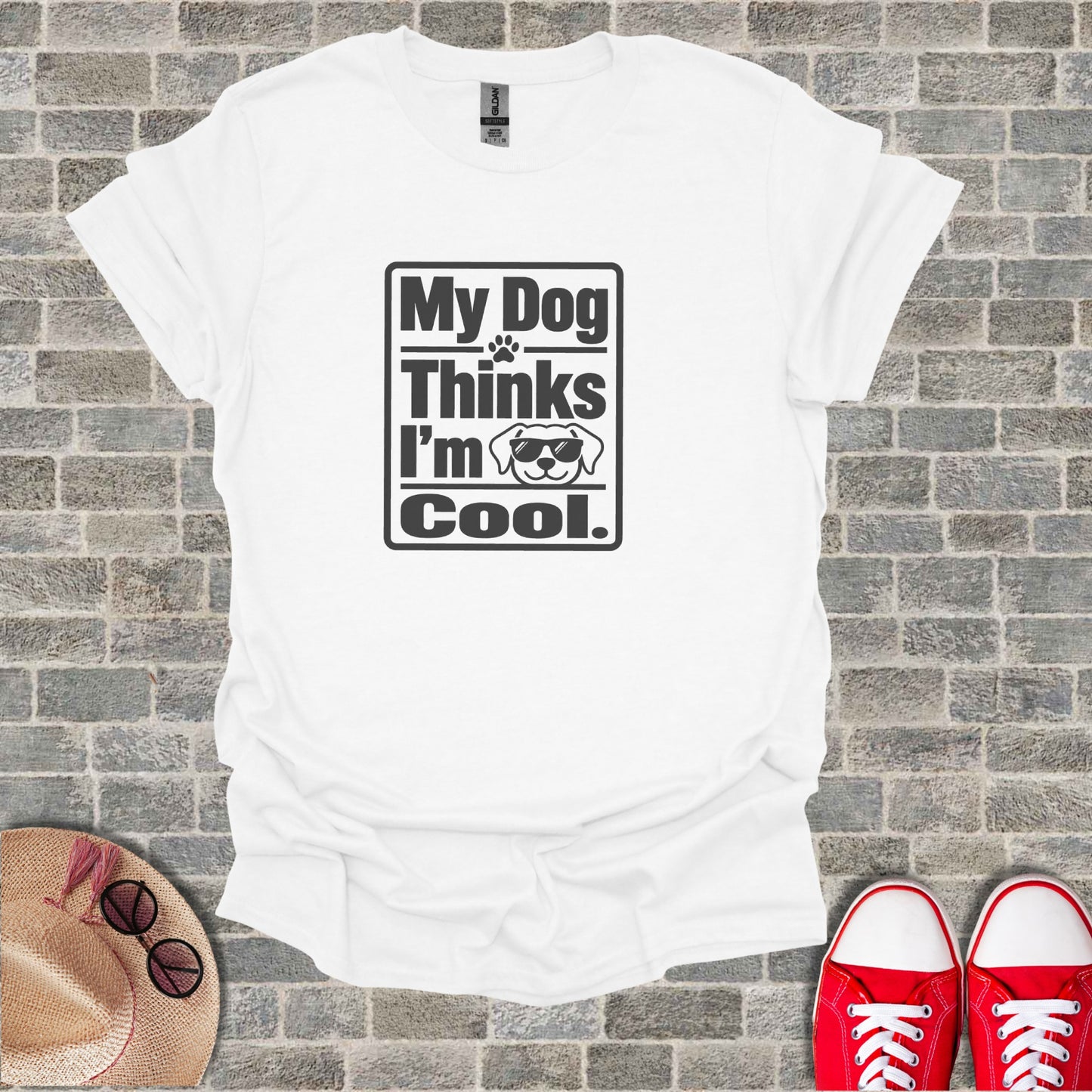 White t-shirt with "My Dog Thinks I'm Cool" and sunglasses-wearing dog graphic.