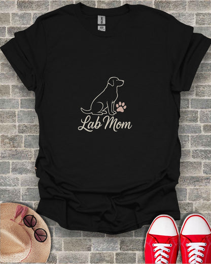 Black t-shirt with a white line drawing of a dog and a paw print, text reads "Lab Mom".